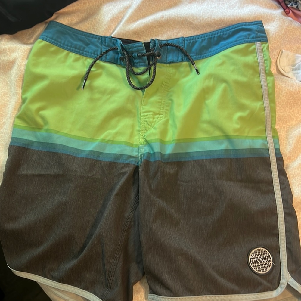Men’s and/or youth size 31 waist board shorts